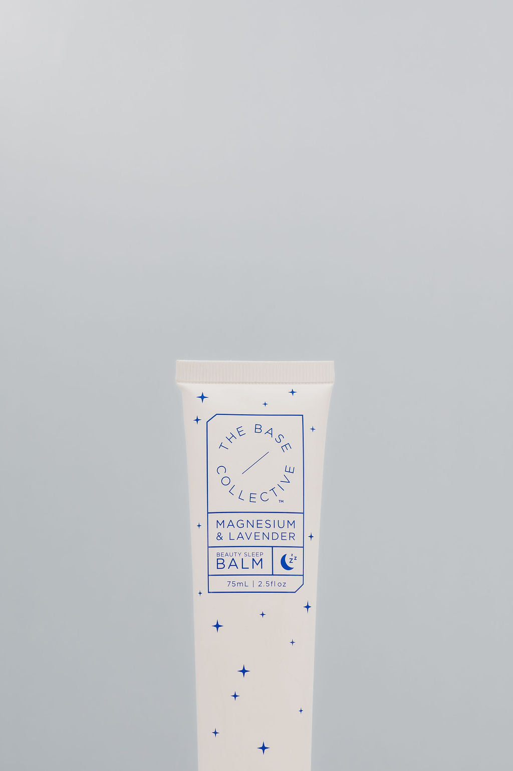 Magnesium & Lavender Cream by the base collective against light blue background 