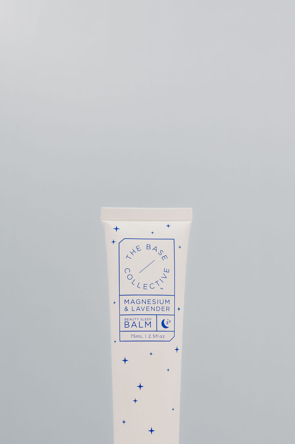 Magnesium & Lavender Cream by the base collective against light blue background