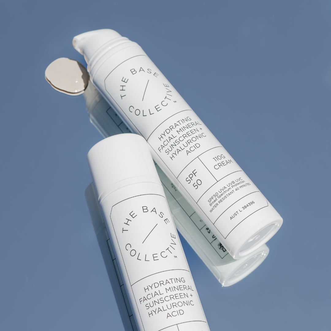 2 bottles of SPF50 Mineral sunscreen with dollop of sunscreen beside right one.