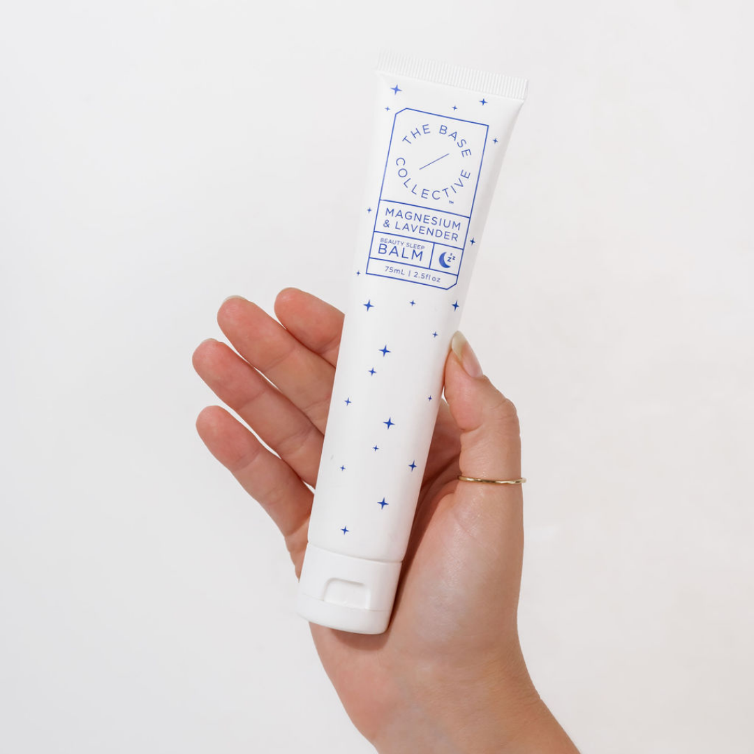 Magnesium and lavender cream by The Base Collective in hand
