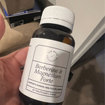 Berberine & Magnesium Glycinate tablets in hand 