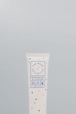 Magnesium & Lavender Cream by the base collective against light blue background 
