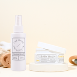 Kids Magnesium Spray bundle on yellow background with lid open on cream