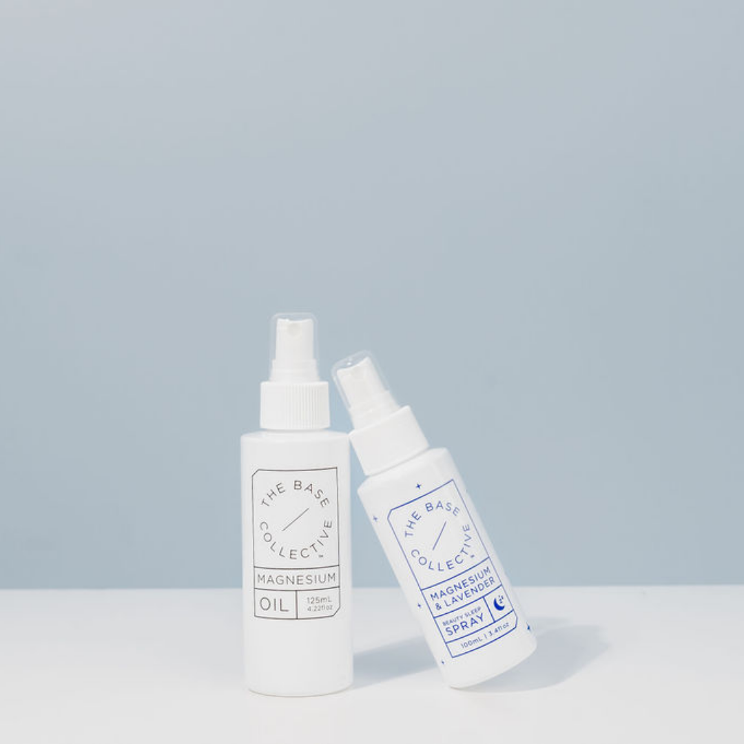 Magnesium Oil Spray & Magnesium Spray for sleep on blue background, leaning against each other 