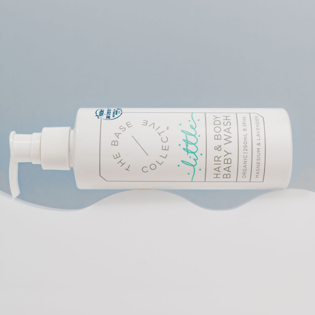 Little by The Base Collective Lavender Baby Wash on side with white cloud and blue background.